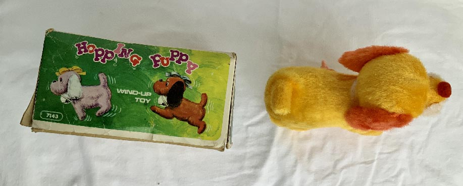 boxed circa 1950's-60's Japanese clockwork plush covered hopping puppy dog wind up toy